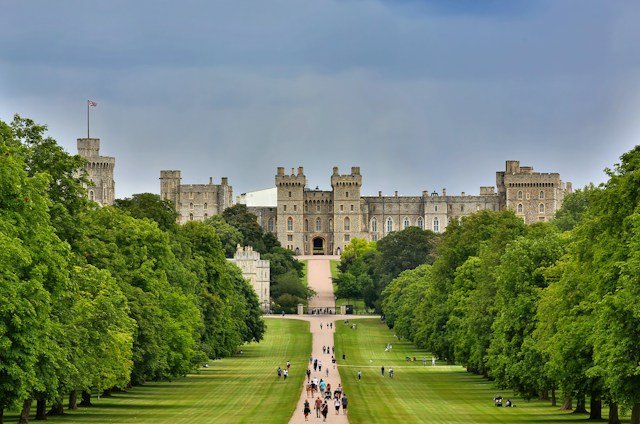 Windsor Castle viewed across the green grounds with its historic stone buildings